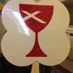 Front of fan distributed by Twin Cities Open & Affirming churches at Twin Cities Pride.