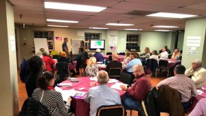 The crowd at the Building an Inclusive Church Training at National City Christian Church listen to Mark Johnston and Kathleen Campisano, Faith and States Organizing Manager at the National LGBTQ Task force, who co-led the training at this event.