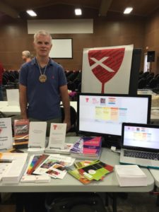 Mark Johnston, Executive Director of GLAD's Open & Affirming Ministry Program, just about finished setting up the O&A table at the Upper Midwest Regional Gathering.